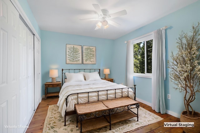 bedroom with ceiling fan, wood-type flooring, and a closet