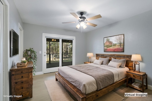 bedroom featuring hardwood / wood-style flooring, access to outside, and ceiling fan