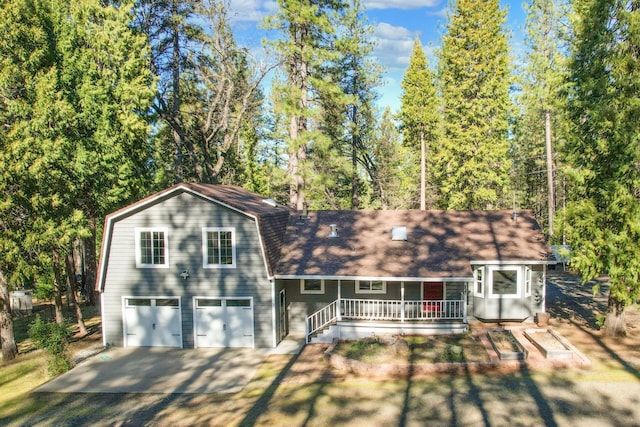 view of front of house featuring a garage and covered porch