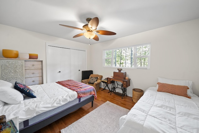 bedroom featuring ceiling fan, wood-type flooring, and a closet