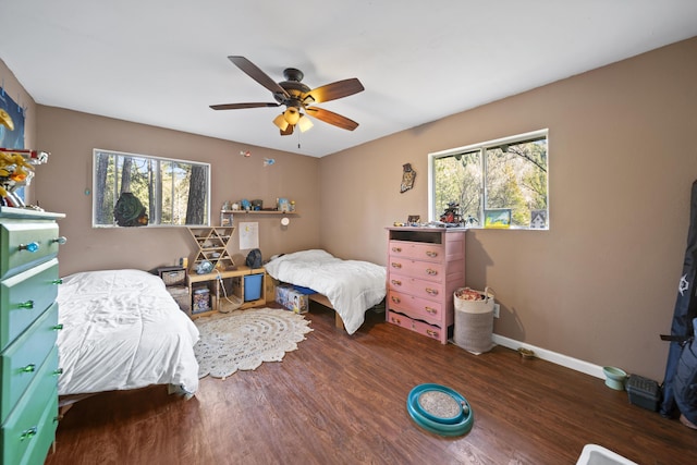 bedroom featuring dark hardwood / wood-style flooring and ceiling fan