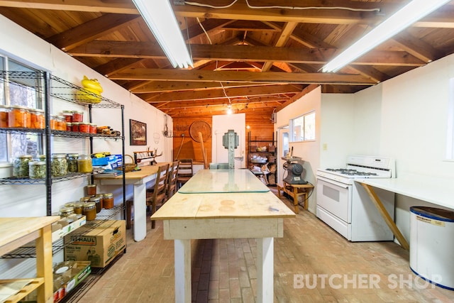 kitchen with vaulted ceiling with beams, white gas stove, and wooden ceiling