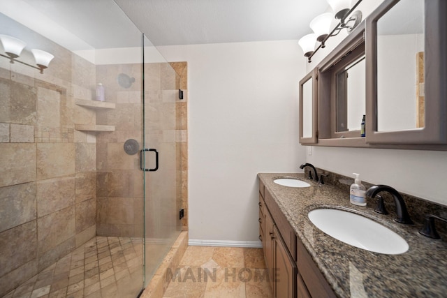 bathroom featuring vanity and a shower with door