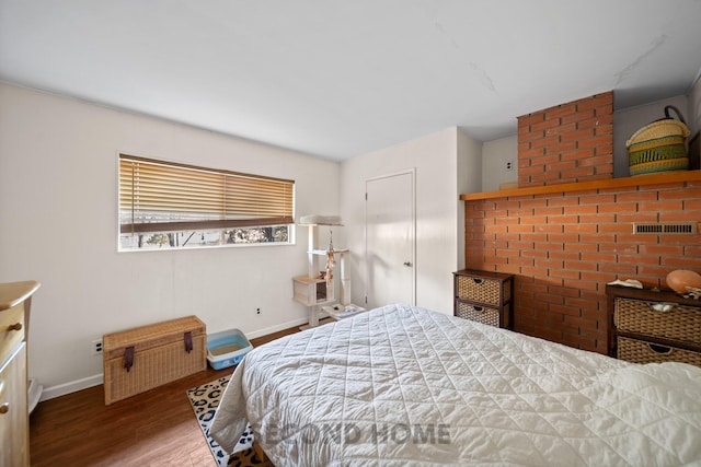 bedroom featuring wood-type flooring and a closet