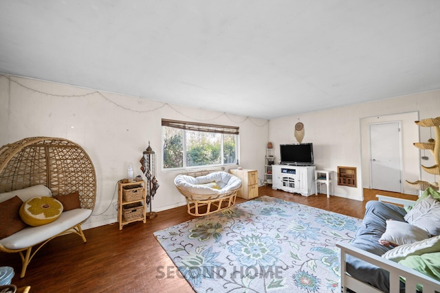 living room with dark hardwood / wood-style flooring