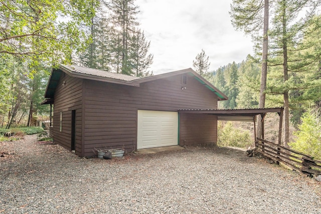 view of side of home with a garage