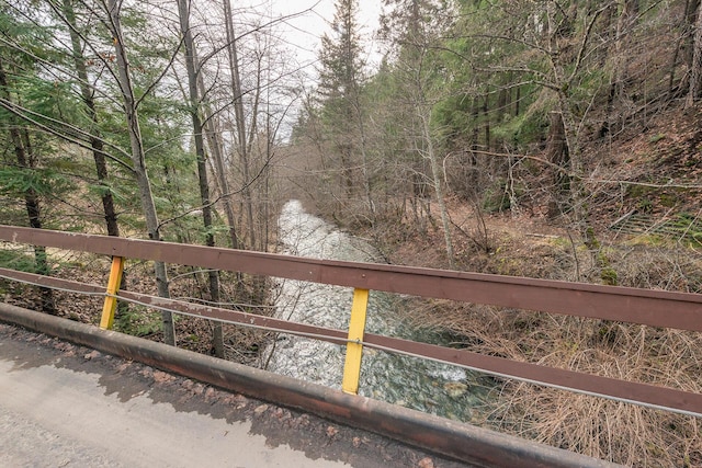 view of gate with a water view