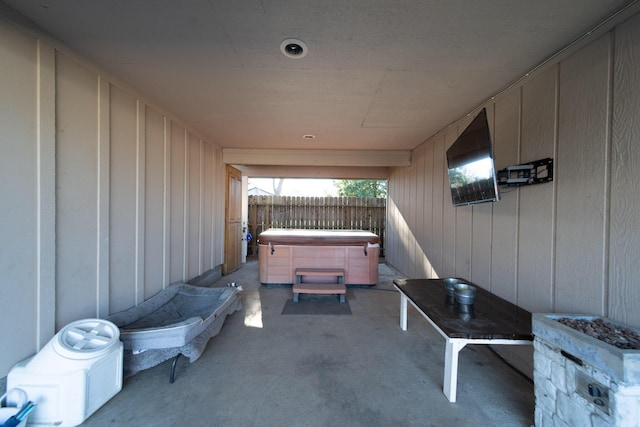 view of patio / terrace with a hot tub