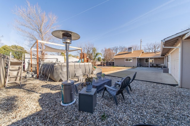 view of yard featuring a swimming pool and a patio area