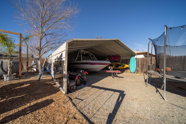 view of vehicle parking with a carport