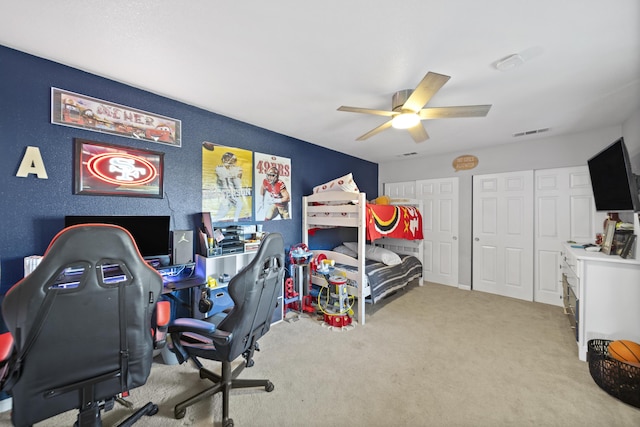 bedroom with ceiling fan and light colored carpet