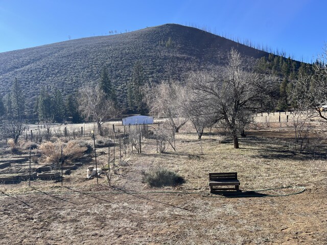 view of mountain feature with a rural view