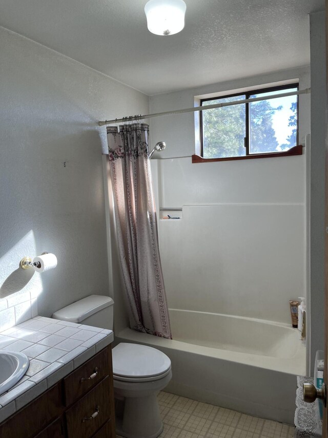 full bathroom featuring vanity, toilet, and shower / tub combo