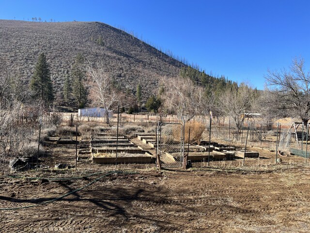 mountain view featuring a rural view