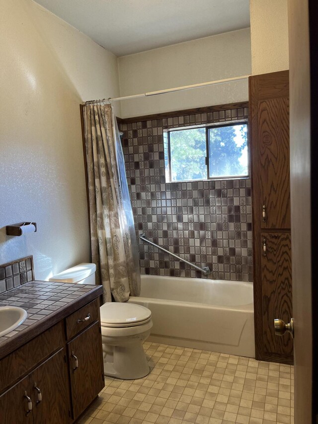 full bathroom with vanity, toilet, and shower / bathtub combination with curtain