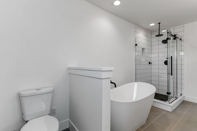 bathroom featuring separate shower and tub, tile patterned floors, and toilet