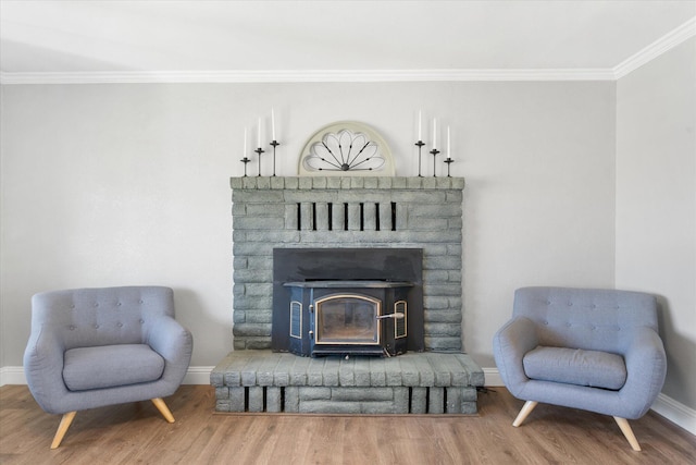 living area featuring ornamental molding and hardwood / wood-style floors