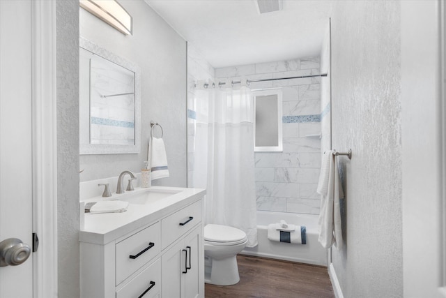 full bathroom featuring hardwood / wood-style flooring, vanity, toilet, and shower / bath combination with curtain