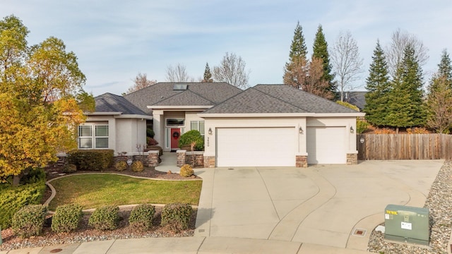 view of front of property with a garage and a front yard