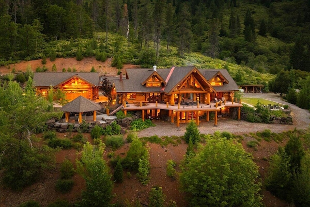 back of house with a gazebo