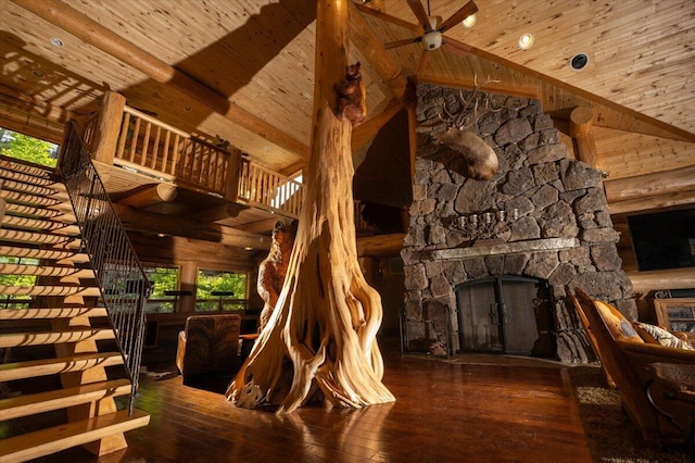 living room with high vaulted ceiling, dark hardwood / wood-style floors, log walls, and wood ceiling