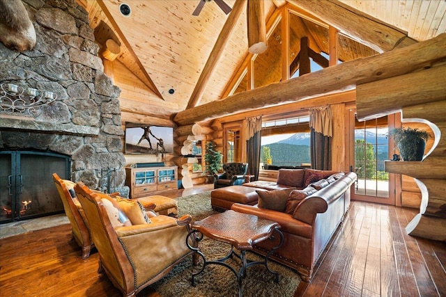 living room featuring log walls, a stone fireplace, hardwood / wood-style flooring, high vaulted ceiling, and beam ceiling