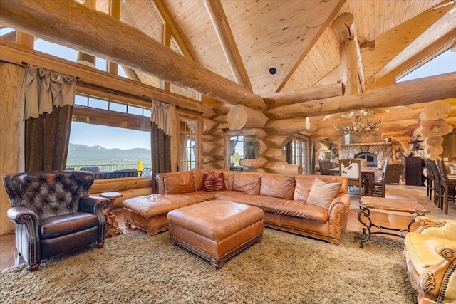 living room with rustic walls, a mountain view, high vaulted ceiling, and beamed ceiling