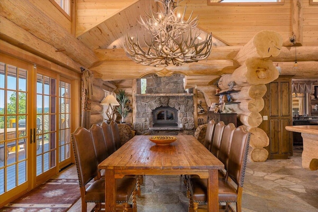 dining space featuring wooden ceiling, french doors, high vaulted ceiling, rustic walls, and a chandelier