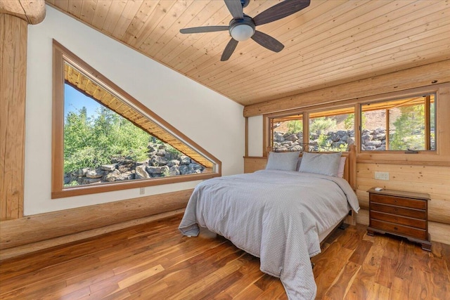 bedroom with ceiling fan, hardwood / wood-style floors, lofted ceiling, and wooden ceiling