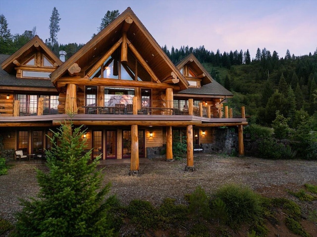 view of back house at dusk