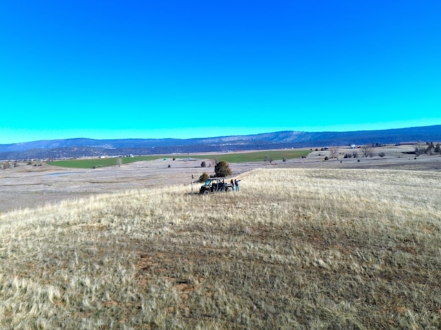 view of mountain feature with a rural view