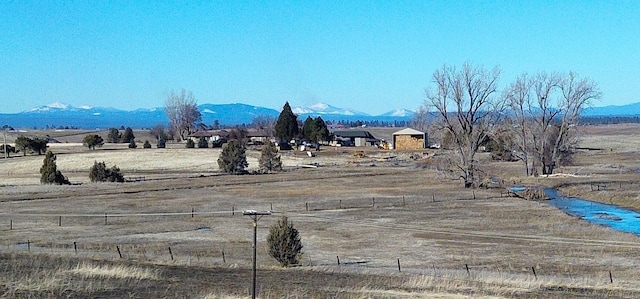 view of mountain feature with a rural view