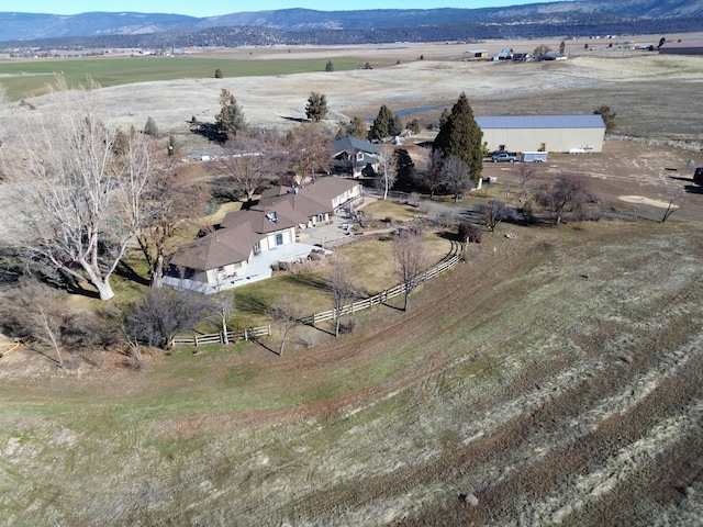 bird's eye view featuring a rural view and a mountain view