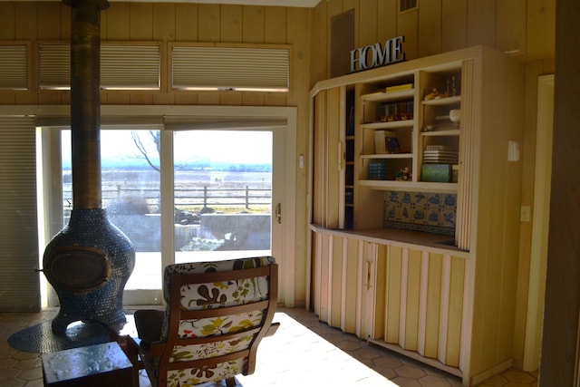 interior space featuring wooden walls and tile patterned flooring