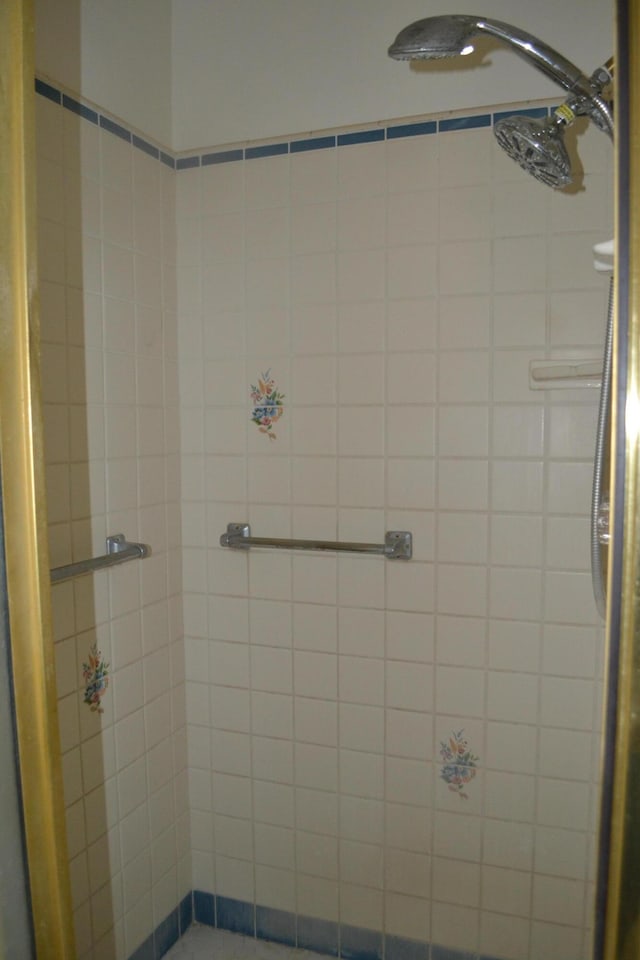 bathroom with tiled shower