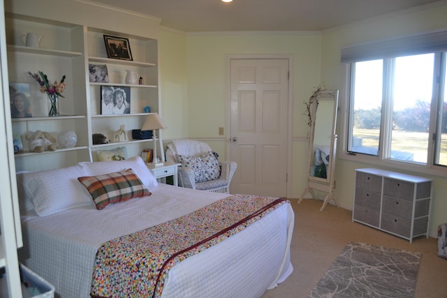 bedroom with light carpet and ornamental molding