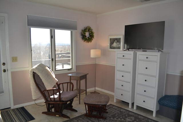 living area with ornamental molding