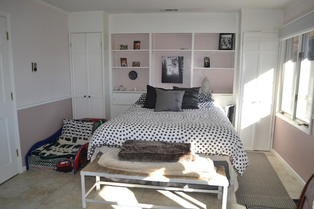 bedroom featuring a closet and ornamental molding