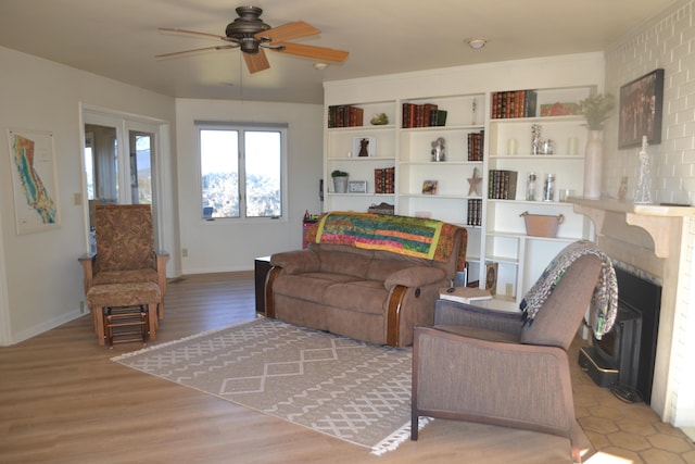 living room with ceiling fan and hardwood / wood-style flooring