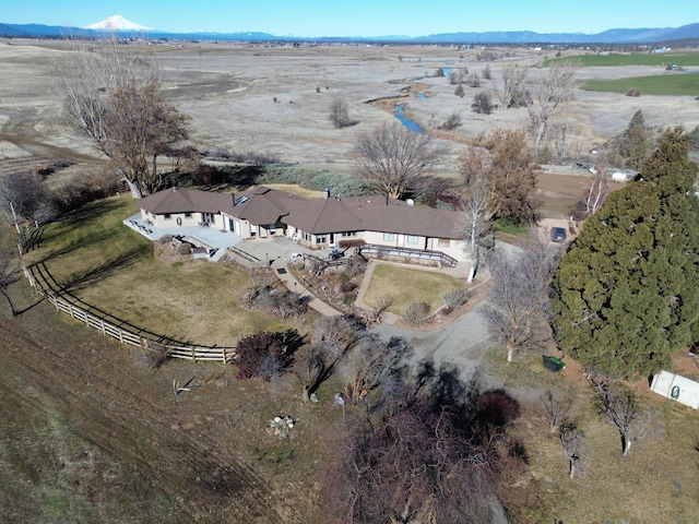 birds eye view of property featuring a rural view and a mountain view