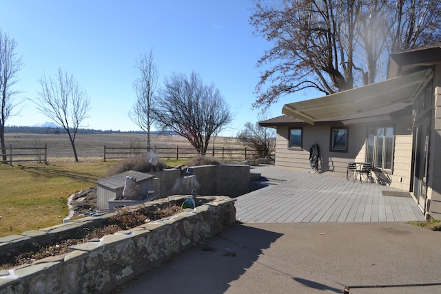 exterior space with a rural view and a yard