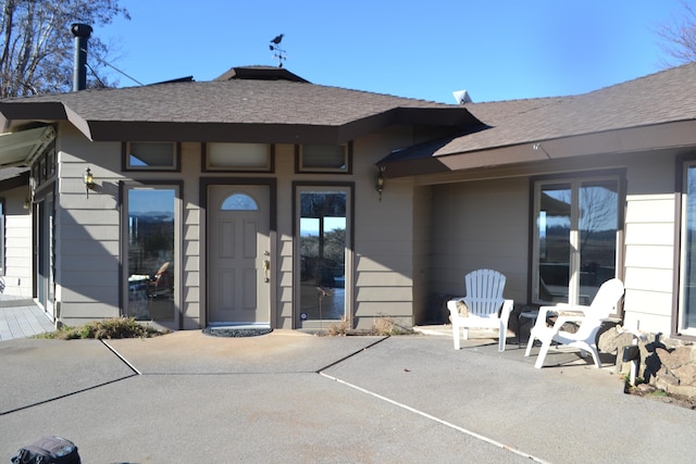 property entrance with a patio area