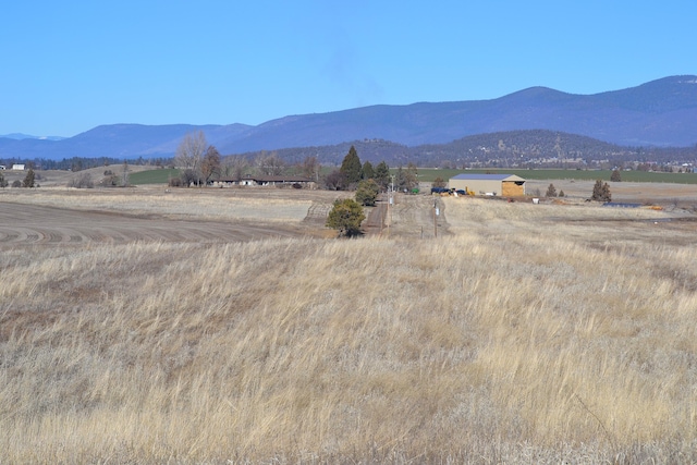 mountain view featuring a rural view