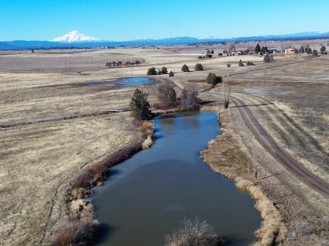 bird's eye view featuring a rural view and a water and mountain view