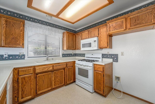 kitchen with sink and white appliances