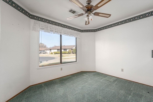 spare room with carpet flooring and ceiling fan