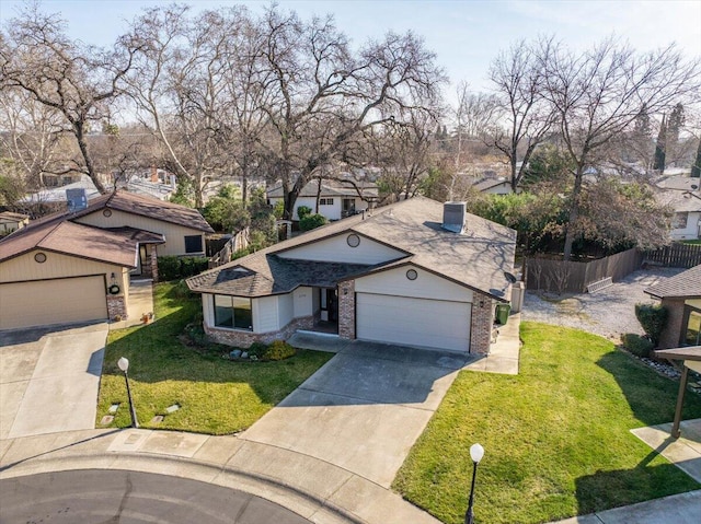 view of front of house featuring a garage and a front yard