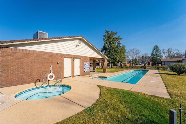 view of pool with a community hot tub, a patio, a lawn, and central air condition unit