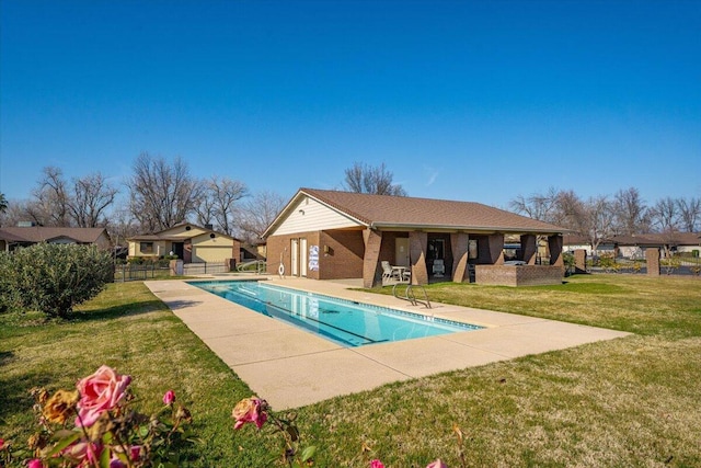 view of swimming pool featuring a lawn and a patio