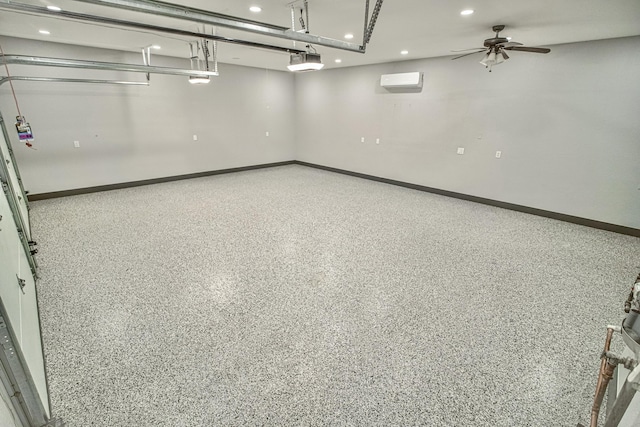 garage featuring a wall mounted air conditioner, ceiling fan, and a garage door opener